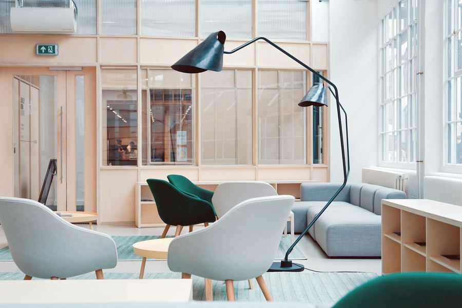 Bright lounge space with armchairs and sofas